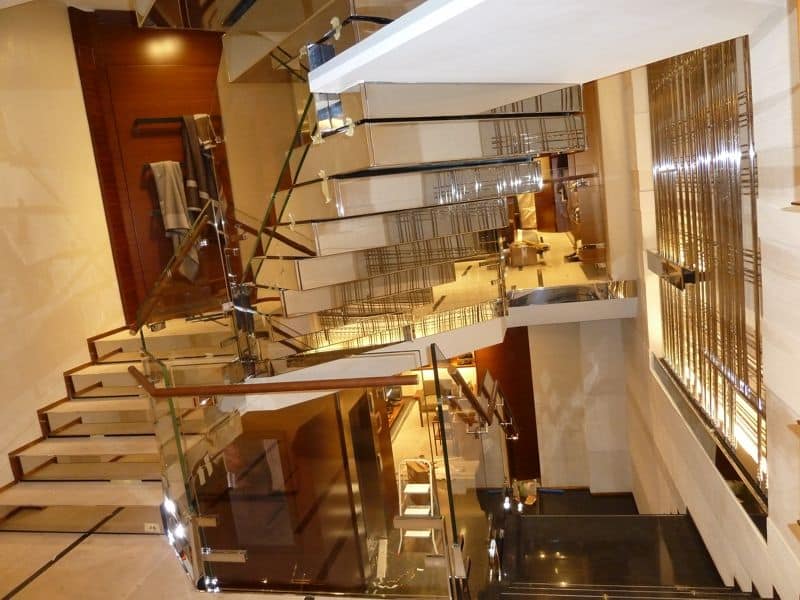 Polished stainless steel stairs, Construction and installation of monumental stairway for showrooms and hotels