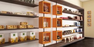 Revolution - shelves for bakeries and cafes, Exhibition wall with rotating cubes