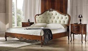 P 704, Walnut bed, with carvings and quilted headboard