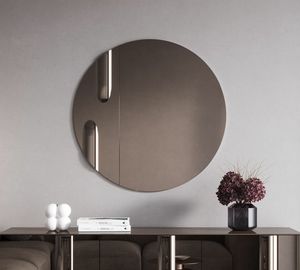 Giunione, Round mirror with bronzed elements with relief workmanship