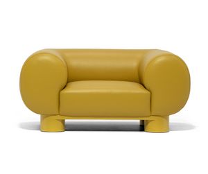Aster, Armchair with cylindrical armrests, soft and generous in shape