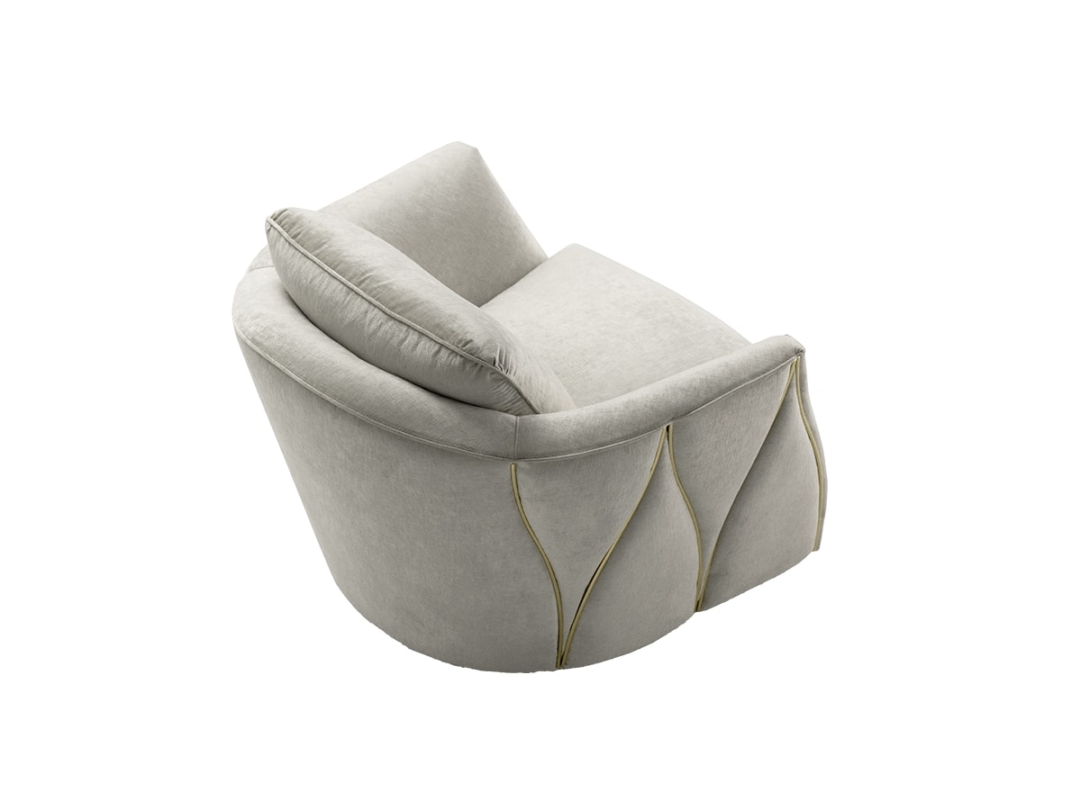 Ava, Armchair with rounded shape and metal decorations