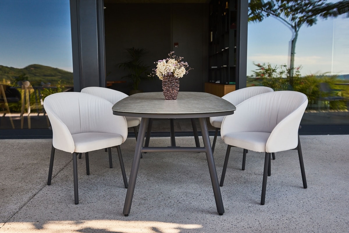 MUSA P, Enveloping upholstered armchair for outdoors