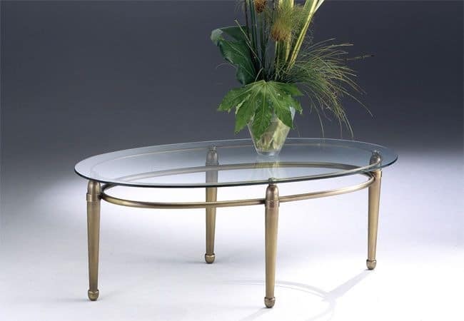 Oval coffee table made of brass, glass top, for living room