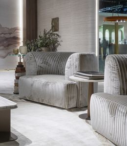 Dune armchair, Enveloping armchair and sober elegance